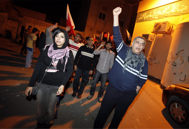 Zainab Al-Khawaja (left) and Nabeel Rajab (right), both active members of the BCHR marching during protests in Bahrain. Both have been in and out of prison on charges varying from "showing contempt for the regime" and "participation in illegal assembly".