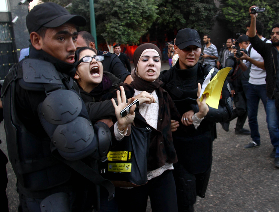 Mona Seif being detained during a protest in November 2013 [source: egyptianstreets.com]
