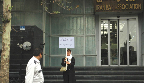 Nasrin Sotoudeh protesting alone for Workers' Rights outside the Bar Association in Tehran.